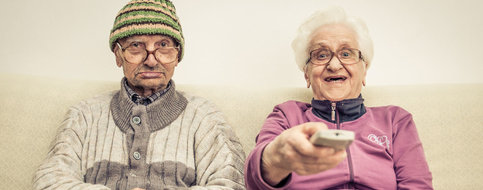 Old couple watching TV